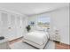 Clean bedroom with wood flooring and a large window, plus ample storage at 1137 King Arthur Ct # 510, Dunedin, FL 34698