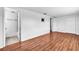 Spacious bedroom with wood floors, a tv mount and easy access to a full bathroom at 1137 King Arthur Ct # 510, Dunedin, FL 34698