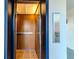 Elevator cab with wood grain paneling and a tile floor at 1137 King Arthur Ct # 510, Dunedin, FL 34698