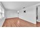 Bright living room with wood flooring and neutral walls, ready for personalization at 1137 King Arthur Ct # 510, Dunedin, FL 34698