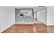 Living space with hardwood floors and a kitchen view through a window at 1137 King Arthur Ct # 510, Dunedin, FL 34698