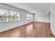 Bright living space with hardwood floors and large windows offering ample natural light at 1137 King Arthur Ct # 510, Dunedin, FL 34698