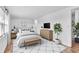 Stylishly furnished main bedroom with a neutral palette and ample natural light at 1137 King Arthur Ct # 510, Dunedin, FL 34698