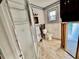 Picture of the bathroom, including toilet, shower, and decorative wallpaper, of a property for sale at 119 11Th Ave, Indian Rocks Beach, FL 33785
