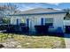 Cute bungalow style home with blue accents and a small front yard at 119 11Th Ave, Indian Rocks Beach, FL 33785
