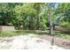 Private backyard surrounded by trees and a fence at 13017 Manatee Ave, New Port Richey, FL 34654