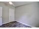 Bedroom with wood-look floors and a closet at 13017 Manatee Ave, New Port Richey, FL 34654