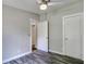 Spacious bedroom with wood-look floors and ceiling fan at 13017 Manatee Ave, New Port Richey, FL 34654