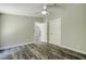 Spacious bedroom with gray walls and wood-look flooring at 13017 Manatee Ave, New Port Richey, FL 34654