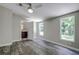 Bedroom with ensuite bathroom and wood-look floors at 13017 Manatee Ave, New Port Richey, FL 34654
