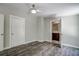 Bedroom with wood-look flooring and an ensuite bathroom at 13017 Manatee Ave, New Port Richey, FL 34654