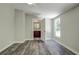 Bedroom with ensuite bathroom and wood-look floors at 13017 Manatee Ave, New Port Richey, FL 34654