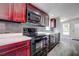 Modern kitchen with dark wood cabinets and white marble countertops at 13017 Manatee Ave, New Port Richey, FL 34654