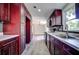 Modern kitchen with dark wood cabinets and white marble countertops at 13017 Manatee Ave, New Port Richey, FL 34654
