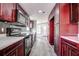Modern kitchen with dark wood cabinets and white marble countertops at 13017 Manatee Ave, New Port Richey, FL 34654