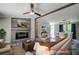 Open living room featuring a fireplace and access to the dining area at 13017 Manatee Ave, New Port Richey, FL 34654