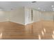 Spacious living room with hardwood floors, neutral paint, and recessed lighting at 1310 Meres Blvd, Tarpon Springs, FL 34689