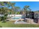 Large backyard with pool, hot tub, and lush landscaping at 13510 Shady Shores Dr, Tampa, FL 33613