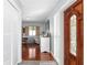 Bright and airy entryway with wood floors and built-in shelving at 13510 Shady Shores Dr, Tampa, FL 33613