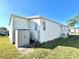 Charming home exterior with well-maintained lawn at 145 Blue Marlin Dr, Oldsmar, FL 34677