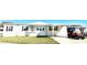 Cozy single-story home featuring a covered parking area with direct access to the front entrance at 145 Blue Marlin Dr, Oldsmar, FL 34677