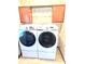 Laundry room has a full-size Samsung washer and dryer with storage cabinets above at 145 Blue Marlin Dr, Oldsmar, FL 34677