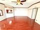 Open-concept space with hardwood flooring and a bright atmosphere, ideal for Gathering gatherings at 145 Blue Marlin Dr, Oldsmar, FL 34677