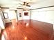 Sunlit living area featuring hardwood flooring, creating an inviting space for relaxation and entertainment at 145 Blue Marlin Dr, Oldsmar, FL 34677