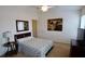 Comfortable bedroom with a queen bed and en-suite bathroom at 1552 Blue Magnolia Rd, Brandon, FL 33510