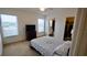 Spacious bedroom with a queen bed and en-suite bathroom at 1552 Blue Magnolia Rd, Brandon, FL 33510