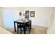 Small dining area with a table and four chairs, next to stairs at 1552 Blue Magnolia Rd, Brandon, FL 33510