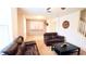 Living Room with brown leather reclining sofas and a coffee table at 1552 Blue Magnolia Rd, Brandon, FL 33510