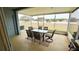 Screened patio with table and chairs, overlooking a backyard at 1552 Blue Magnolia Rd, Brandon, FL 33510