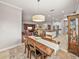 Open concept dining room with views into the kitchen and living areas at 16959 Scuba Crest St, Wimauma, FL 33598