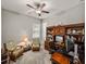 Home office with built-in shelving, comfortable seating, and a work desk at 16959 Scuba Crest St, Wimauma, FL 33598