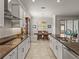 Modern kitchen with granite countertops and stainless steel appliances at 16959 Scuba Crest St, Wimauma, FL 33598