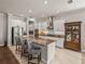 Gourmet kitchen featuring granite island and white cabinetry at 16959 Scuba Crest St, Wimauma, FL 33598