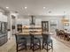 Island kitchen with granite countertops and breakfast bar at 16959 Scuba Crest St, Wimauma, FL 33598