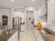 Bright kitchen with stainless steel appliances and an island at 16959 Scuba Crest St, Wimauma, FL 33598