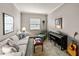 Relaxing living room with comfy sofa, piano, and adjoining bathroom at 16959 Scuba Crest St, Wimauma, FL 33598