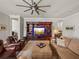 Relaxing living room with built-in shelving and a large TV at 16959 Scuba Crest St, Wimauma, FL 33598