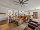 Spacious living room featuring a sectional sofa and built-in entertainment center at 16959 Scuba Crest St, Wimauma, FL 33598