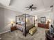 Main bedroom with a king-size bed, ensuite bathroom access, and ample natural light at 16959 Scuba Crest St, Wimauma, FL 33598