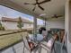 Screened patio with outdoor furniture and a grill at 16959 Scuba Crest St, Wimauma, FL 33598