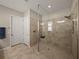 Large walk-in shower with tiled walls and built-in seat at 16959 Scuba Crest St, Wimauma, FL 33598