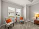 Bright sitting room with two armchairs and a small side table at 16959 Scuba Crest St, Wimauma, FL 33598