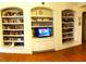 Living room features built-in shelving and hardwood floors at 18108 Sugar Brooke Dr, Tampa, FL 33647