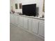 Large flat-screen TV and built-in media cabinet at 18108 Sugar Brooke Dr, Tampa, FL 33647