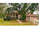 Attractive one-story home with a two-car garage and landscaped yard at 18108 Sugar Brooke Dr, Tampa, FL 33647