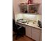 Small home office with built-in desk and shelving at 18108 Sugar Brooke Dr, Tampa, FL 33647